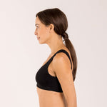 Woman wearing a black bra made from seaweed for menopause 