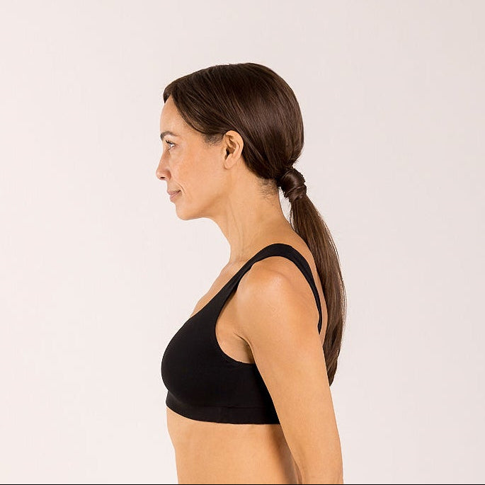 Woman wearing a black bra made from seaweed for menopause 