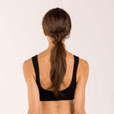 Woman wearing a crop top bra made from seaweed for menopause