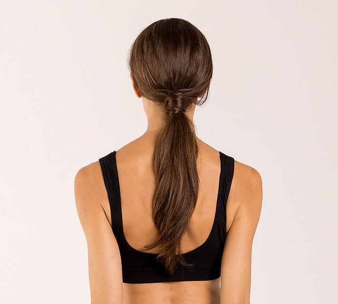 Woman wearing a crop top bra made from seaweed for menopause